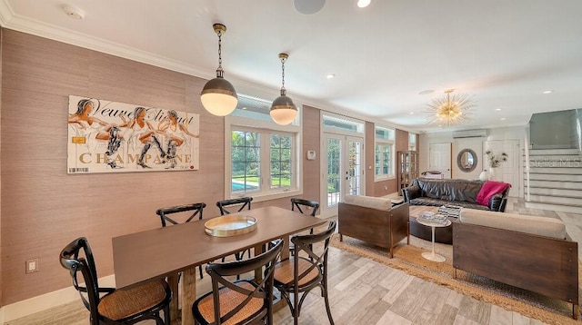 dining room featuring light wood finished floors, stairway, ornamental molding, a wall mounted air conditioner, and french doors