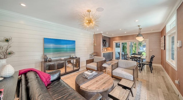 living area with recessed lighting, crown molding, light wood-style flooring, and baseboards