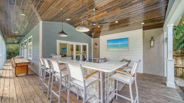 wooden deck with outdoor dining space