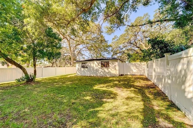 view of yard with a fenced backyard