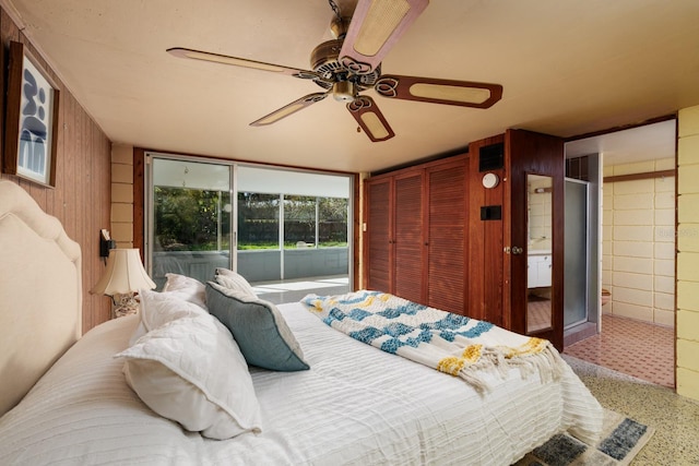 bedroom with access to exterior and a ceiling fan