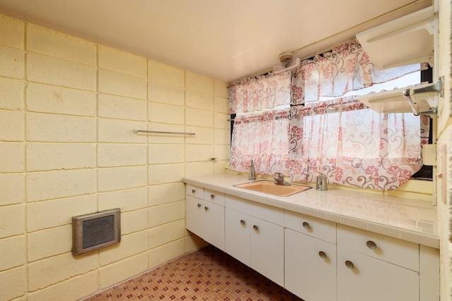 bathroom featuring vanity and heating unit