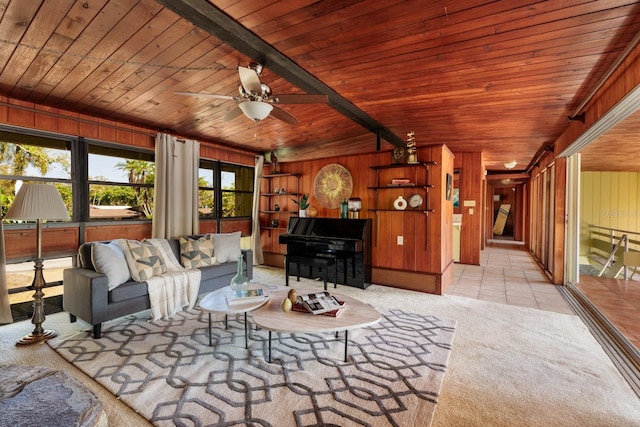 unfurnished living room featuring tile patterned floors, wooden walls, wooden ceiling, and carpet