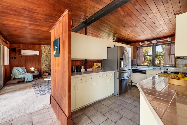 kitchen with tile countertops, stainless steel fridge with ice dispenser, white dishwasher, a sink, and an AC wall unit