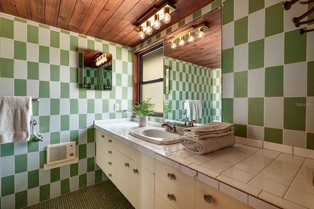 bathroom featuring tile walls, wood ceiling, and vanity