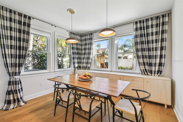 4012 W Morrison Ave, Tampa, FL 33629 - dining space with breakfast area, baseboards, and light wood-style floors