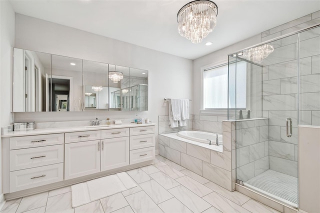 4012 W Morrison Ave, Tampa, FL 33629 - full bathroom featuring a garden tub, vanity, a shower stall, and an inviting chandelier