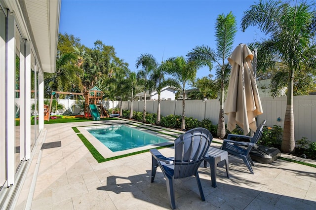 4012 W Morrison Ave, Tampa, FL 33629 - view of pool featuring a patio, a fenced backyard, and a playground
