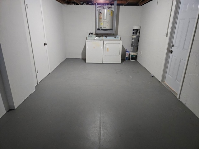 unfinished basement with washer and dryer and electric water heater