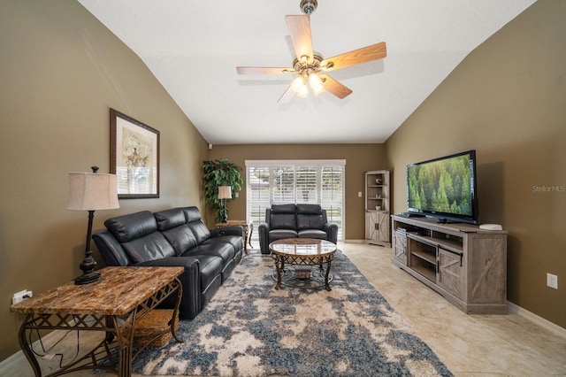 living area featuring a ceiling fan, vaulted ceiling, and baseboards