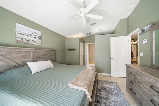 bedroom featuring a ceiling fan, lofted ceiling, visible vents, and light tile patterned floors