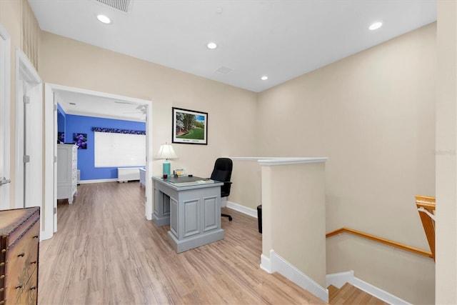 office area with light wood finished floors, visible vents, baseboards, and recessed lighting