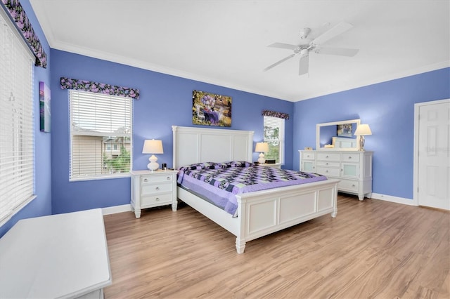 bedroom with ornamental molding, a ceiling fan, light wood-style flooring, and baseboards