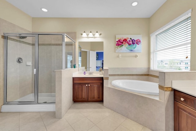 full bath featuring a stall shower, vanity, and tile patterned floors