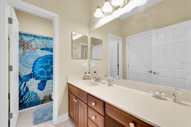 bathroom with baseboards and vanity