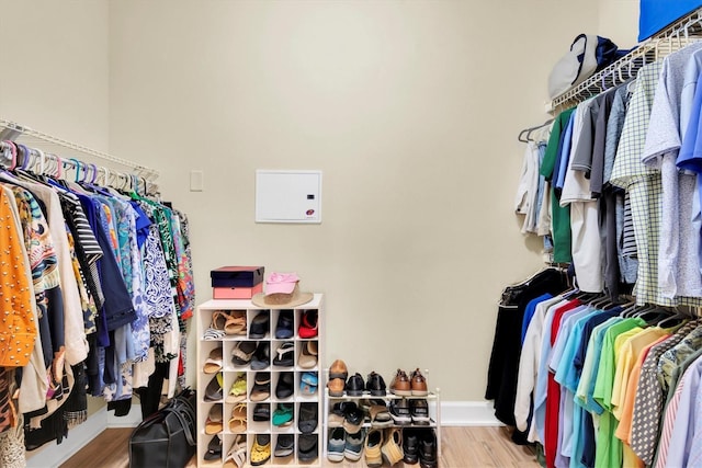 spacious closet with wood finished floors