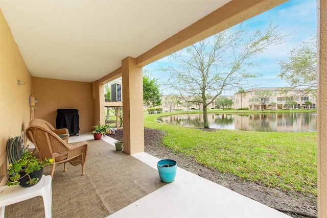 view of patio / terrace with a water view