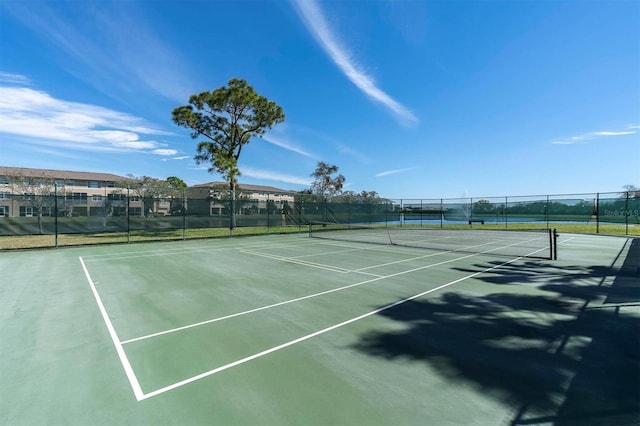 view of sport court with fence