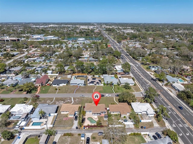 birds eye view of property with a residential view