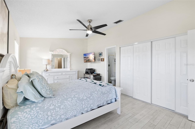 bedroom featuring visible vents, ceiling fan, a closet, light wood-type flooring, and connected bathroom