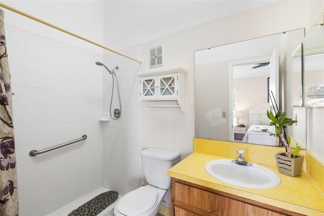 ensuite bathroom featuring visible vents, connected bathroom, vanity, and a tile shower