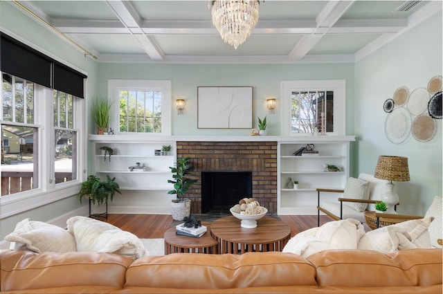 living area with a fireplace, beamed ceiling, wood finished floors, and coffered ceiling