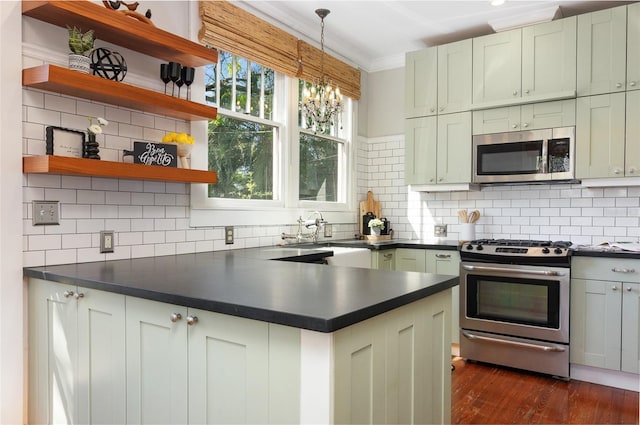 kitchen with open shelves, a sink, stainless steel appliances, crown molding, and dark countertops