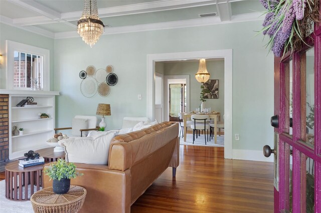 living room with beamed ceiling, visible vents, coffered ceiling, wood finished floors, and an inviting chandelier