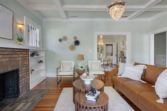 living room featuring beam ceiling, a brick fireplace, wood finished floors, and coffered ceiling