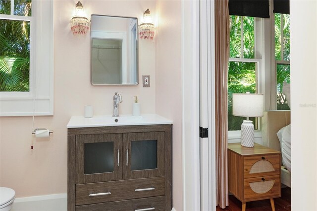 bathroom featuring vanity and toilet