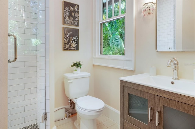 bathroom with toilet, a stall shower, and vanity