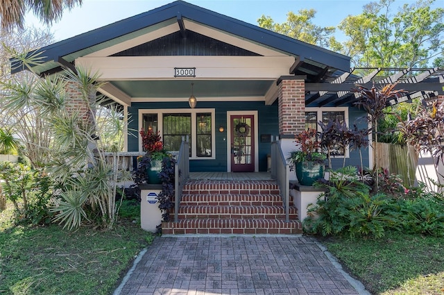 doorway to property with a porch