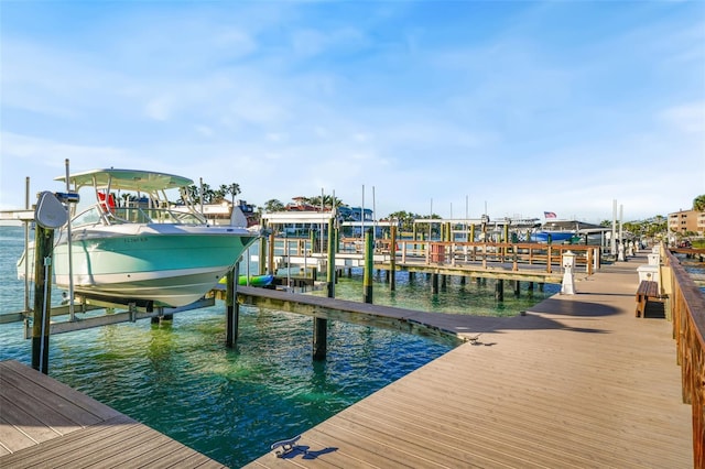 dock area with a water view and boat lift