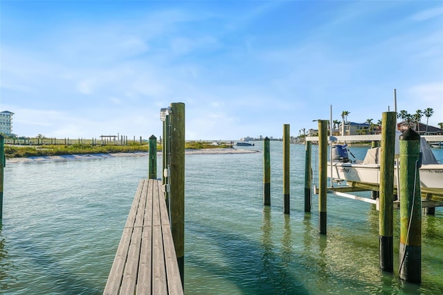 dock area with a water view and boat lift