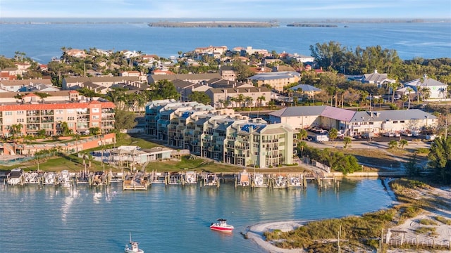 drone / aerial view featuring a water view and a residential view