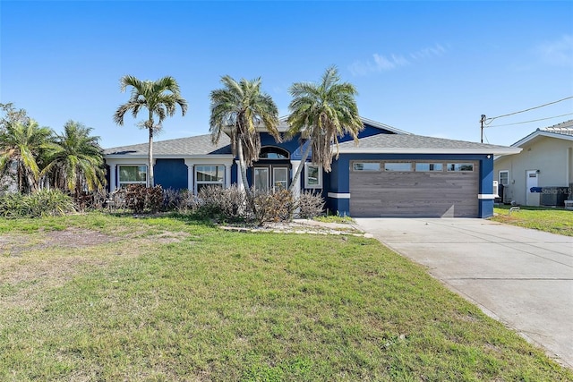 single story home with concrete driveway, an attached garage, cooling unit, a front lawn, and stucco siding