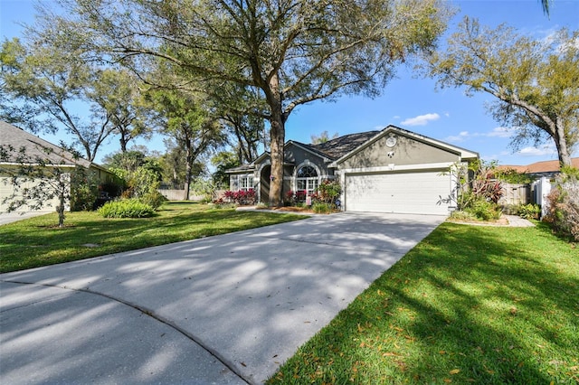 view of front of house with a garage, concrete driveway, a front lawn, and stucco siding