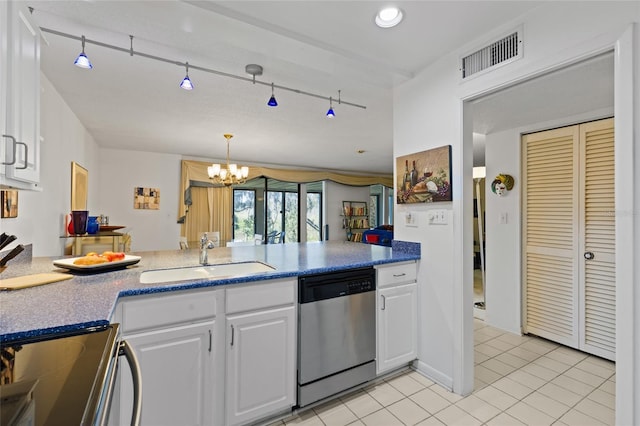 kitchen with light tile patterned flooring, a sink, visible vents, white cabinets, and dishwasher