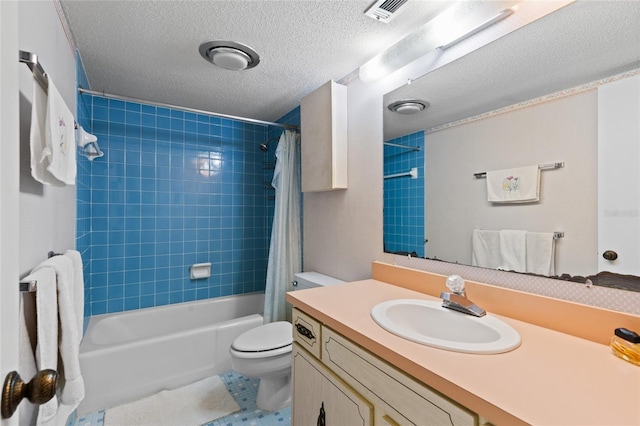 bathroom with visible vents, toilet, shower / tub combo with curtain, a textured ceiling, and vanity