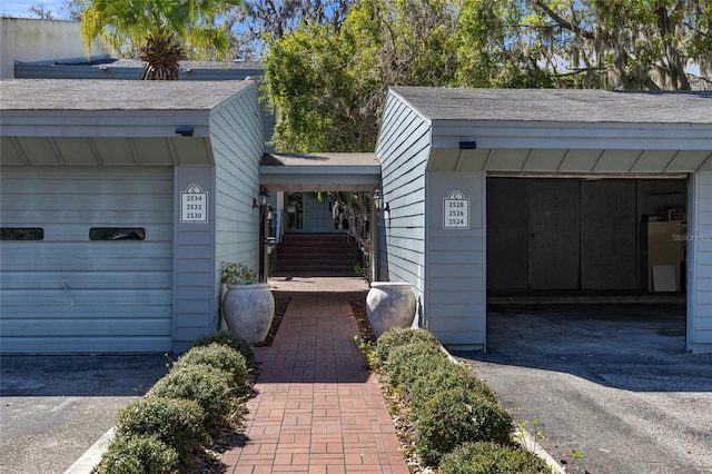 entrance to property with a garage and driveway