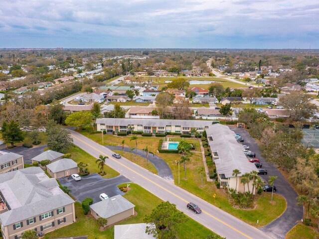 birds eye view of property with a residential view