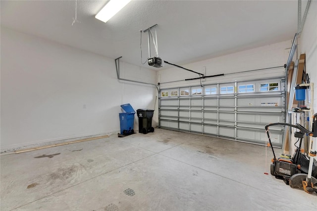 garage featuring a garage door opener