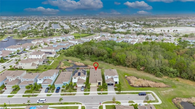 bird's eye view featuring a water view and a residential view