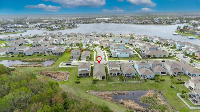 aerial view featuring a water view and a residential view