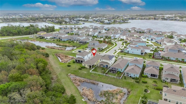 aerial view with a water view and a residential view