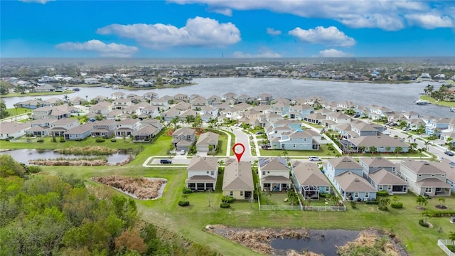 aerial view featuring a residential view and a water view