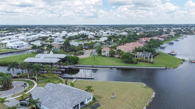 drone / aerial view with a residential view and a water view