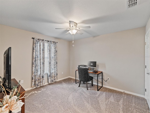 home office featuring a ceiling fan, baseboards, visible vents, and carpet flooring