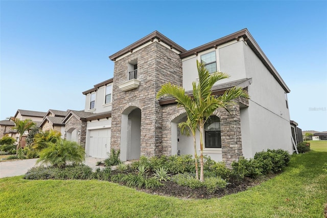 view of front facade featuring a garage, stone siding, a front yard, and stucco siding