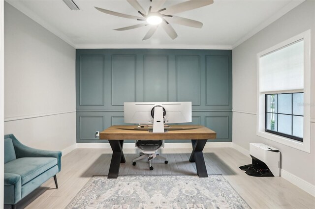 13176 Twin Bridges Dr, Riverview, FL 33579 - home office featuring ceiling fan, light wood-style flooring, crown molding, baseboards, and a decorative wall